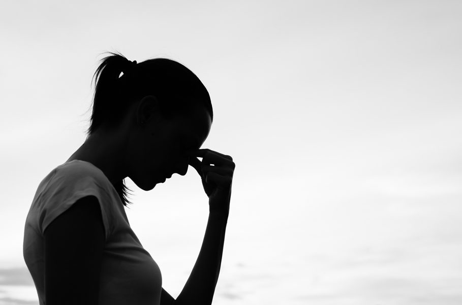 Silhouette of a tired and stressed woman. 