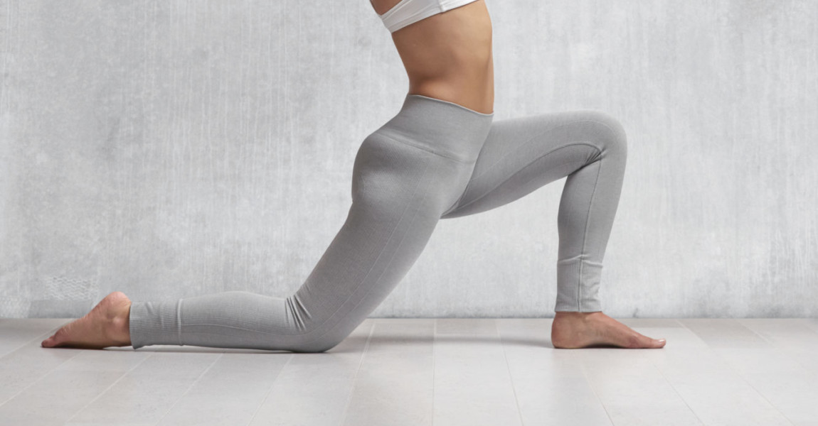 Caucasian woman practicing yoga in studio Caucasian woman practicing yoga in studio 