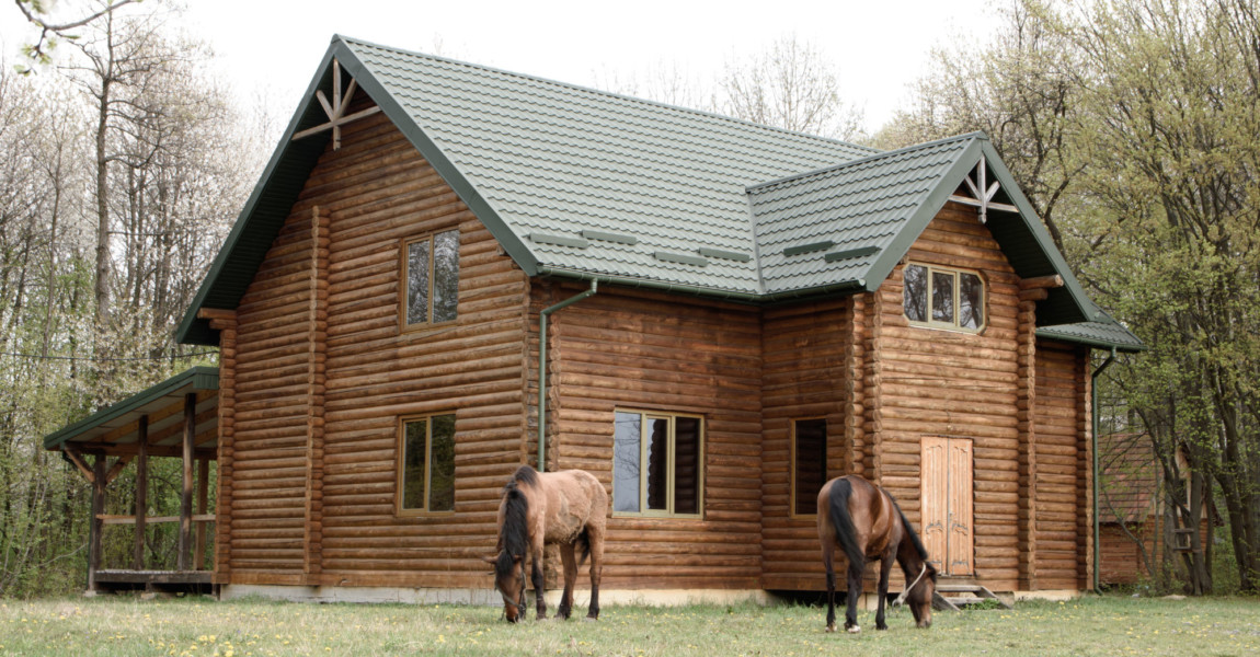 Horses,On,Wooden,House,Background,A,Small,,European-style,Wooden,House Horses on wooden house background 