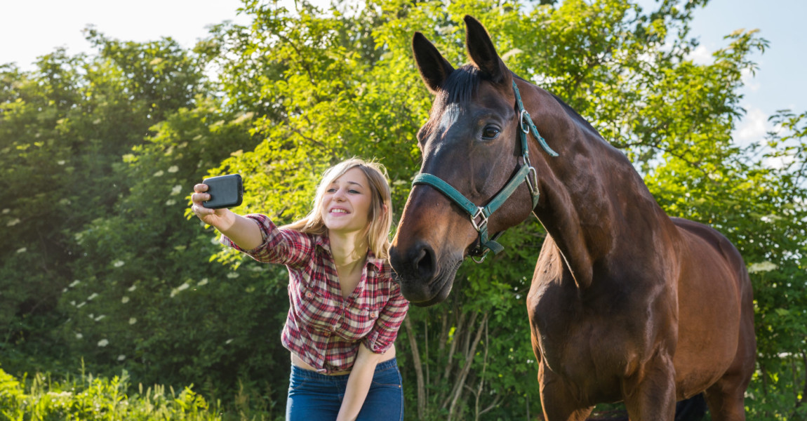 girl taking a selfie girl taking a selfie with his horse 