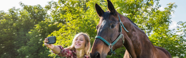 girl taking a selfie girl taking a selfie with his horse 